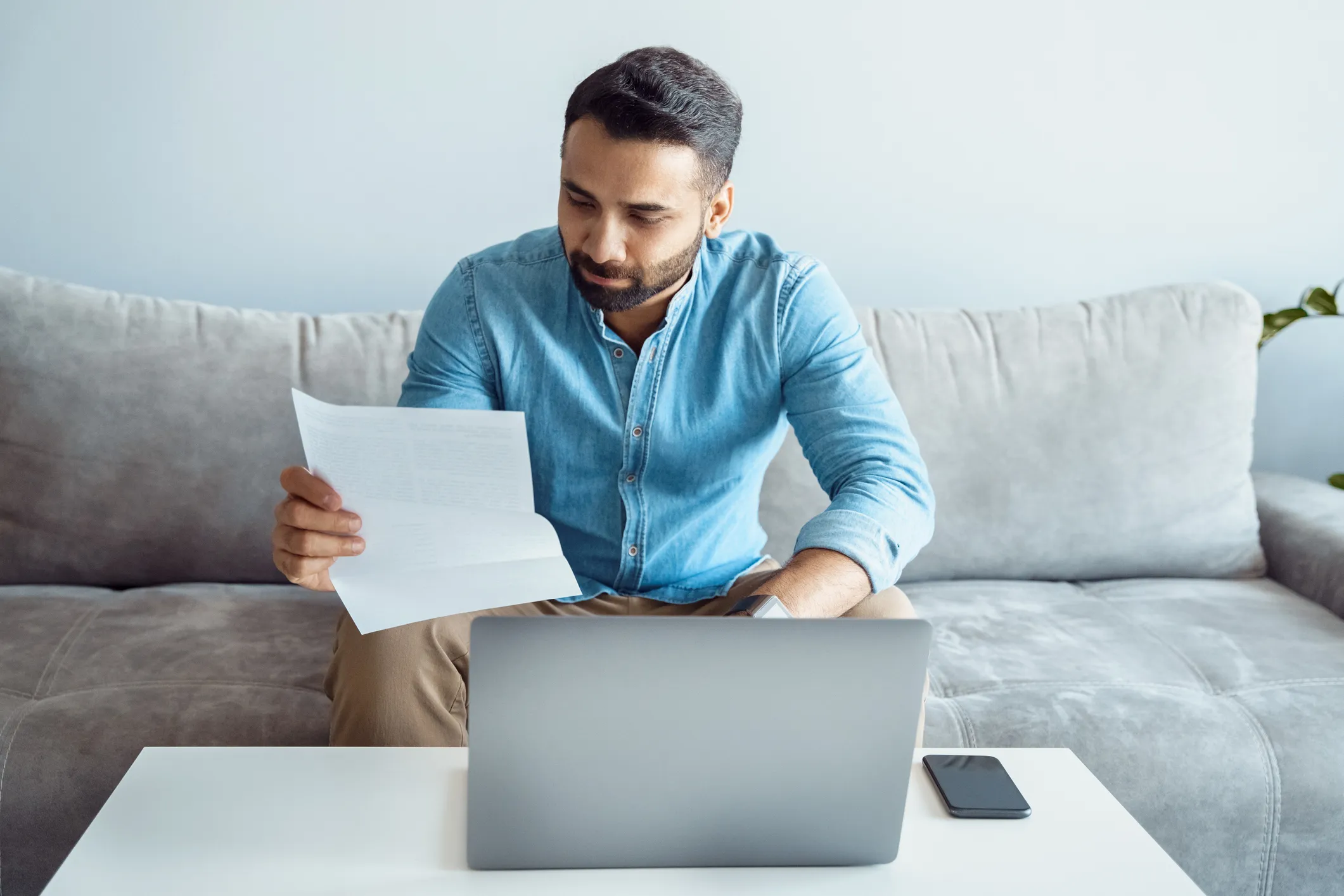 Man looking at tax forms